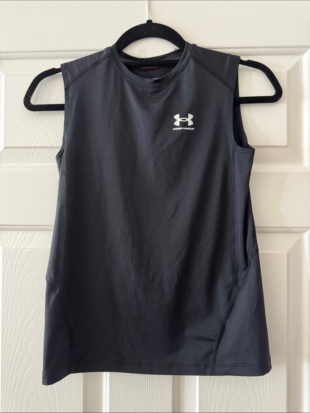 Boys large Under Armour Black Sleeveless Training Tank with White Logo.